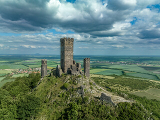 Aerial view of the remains of Hazmburk medieval castle with a circular and rectangular tower sit at...