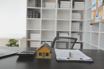 Real estate agent and customer signing contract to buy house, insurance or loan real estate.rent a house,get insurance or loan real estate or property.