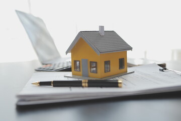 Real estate agent and customer signing contract to buy house, insurance or loan real estate.rent a house,get insurance or loan real estate or property.