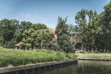 Fototapeta na wymiar Country house by the canal