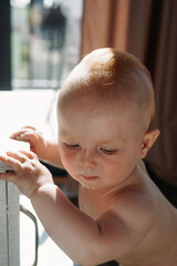 close-up portrait of baby, 10 months old, sweet baby boy, red hair