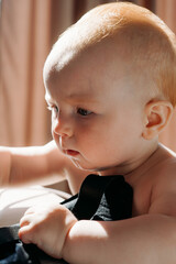 close-up portrait of baby, 10 months old, sweet baby boy, red hair