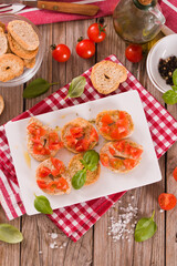 Friselle with cherry tomatoes and basil. - 616768928