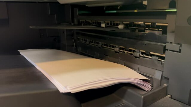 Office printer quickly prints information on paper close-up