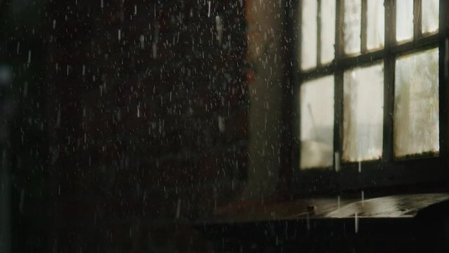 Through the rain-kissed window, the night unveils an abstract cityscape, with wet streets reflecting the illuminated traffic in a mesmerizing blend of light and darkness.