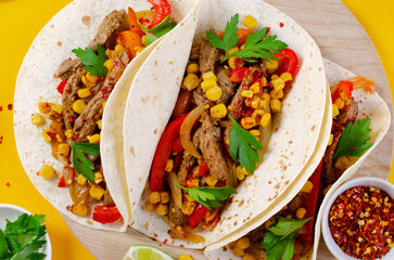 Mexican Tacos with Beef and Vegetables, Tacos al Pastor on Yellow Background