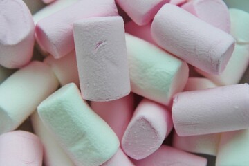 Colorful marshmallows background close up. Fluffy cute marshmallows