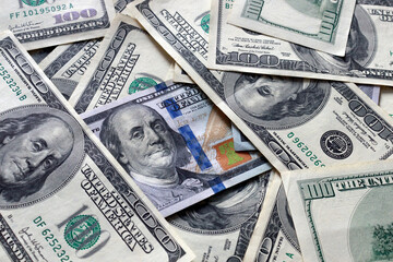 A pile of one hundred US dollars - Banknotes. Cash of hundred dollar bills , dollar background with high resolution