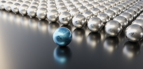 Leadership concept, blue leader ball, standing out from the crowd of silver balls, on black background. 3D Rendering