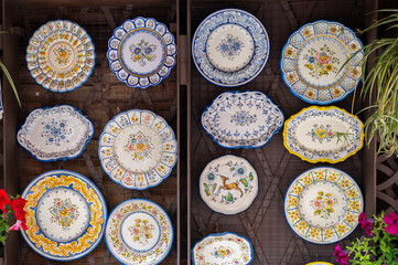 Typical ceramic plates exposed for sale in a street in Toledo (Spain)