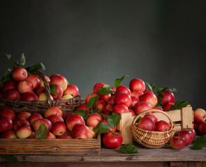 Fototapeta na wymiar red apples on old wooden table on background green wall