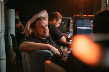 Director at work on the set. The director works with a group or with a playback while filming a...