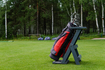 Golf Bag With Bunch of Golf Clubs in the Golf Course.