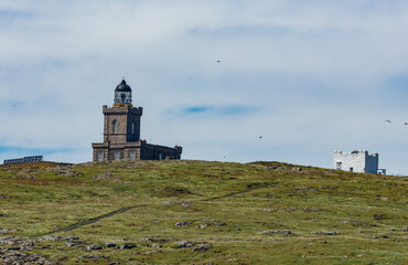 Fototapeta na wymiar Lighthouses on the Isle of May, Scotland, The newest one designed by Robert Stevenson