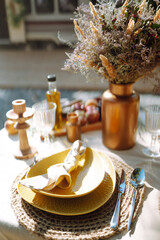 Boho wedding table set. vintage dining table with decorations, flowers and pampas grass Boho style. Table set for an event, party, date or wedding.