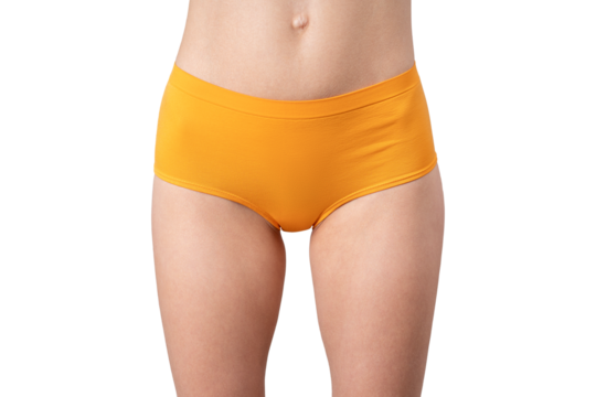 Skinny woman in orange panties, slim female thighs, body care concept