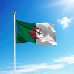 Waving flag of Algeria on flagpole with sky background.