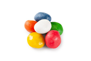 Dragee candy. A pile of multi-colored dragee candies on a white background