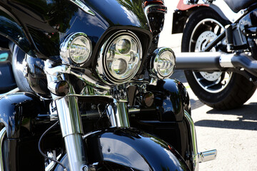 headlight closeup of popular large American made motorcycle. glass lens and shiny chrome finish....