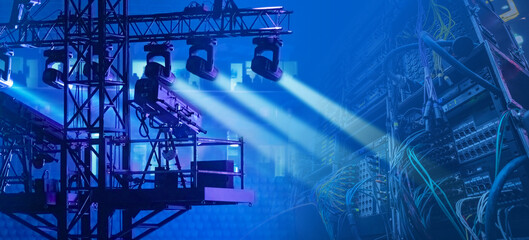 Concert equipment. Searchlights near shelves with wires. Sound equipment for organizing concert. Concept of renting equipment for music festival. Installation for sound controls at concerts