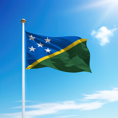 Waving flag of Solomon Islands on flagpole with sky background.