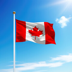 Waving flag of Canada on flagpole with sky background.