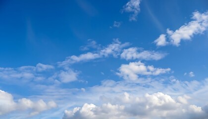 Naklejka na ściany i meble An image of a landscape with a clear sky and white clouds