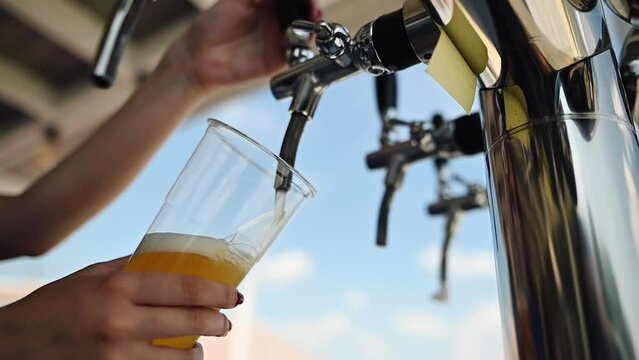 Bartender Pouring Beer In The Bar. Close-up