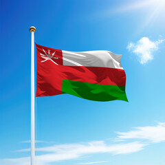 Waving flag of Oman on flagpole with sky background.