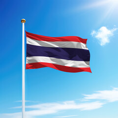 Waving flag of Thailand on flagpole with sky background.