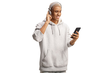 African american young man with headphones listening to music from a mobile phone
