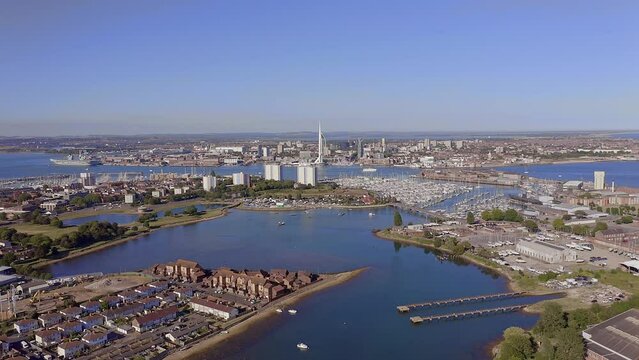Aerial video across Haslar Lake and Haslar marina in Gosport with Portsmouth harbour in view.