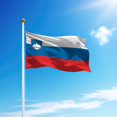 Waving flag of Slovenia on flagpole with sky background.
