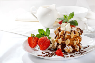 Belgian waffles with strawberries on a white background
