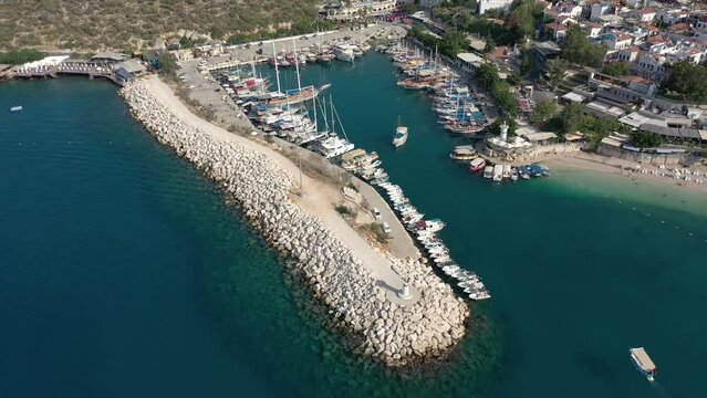 Aerial view of Kalkan town with marina, yachts, houses and streets