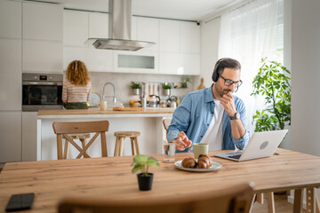 One man caucasian male freelancer work from home on laptop computer