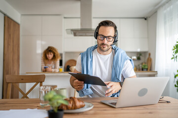 Fototapeta premium One man caucasian male freelancer work from home on laptop computer