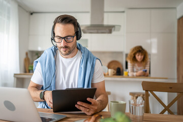 One man caucasian male freelancer work from home on laptop computer