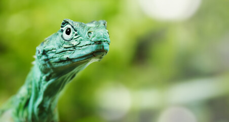 Fototapeta premium green dragon lizard on natural background created with generative ai technology