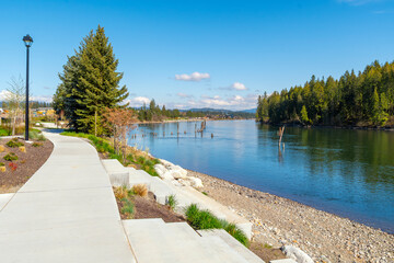 A small riverfront park and beach at a new home development along the Spokane River in the rural city of Coeur d'Alene, Idaho, USA, part of the North Idaho panhandle region.