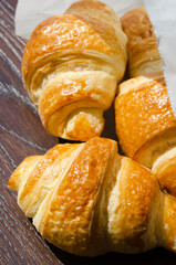 Freshest croissant in a paper envelope in the morning sun.