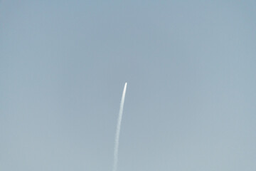 Space rocket launch on the east coast of Florida. Sun reflection on the plume