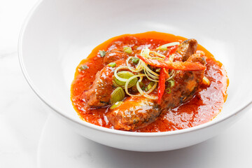 Mackerel fish in tomato sauce on plate and white background, Mackerel canned.