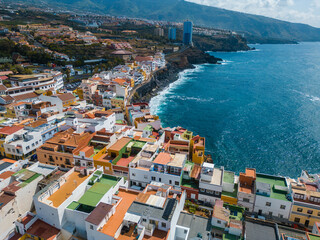 blue water ocean shore, small cozy village Punta Brava, Tenerife, Canary aerial