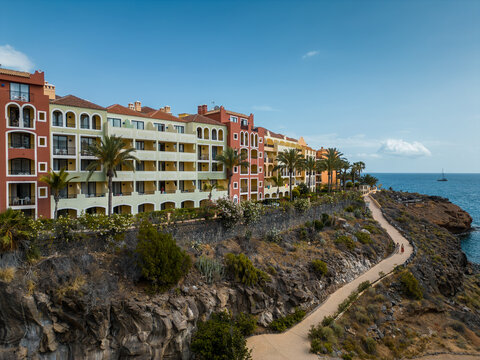 cozy colorful town with houses, hotels and resorts on cliff, Tenerife, Canary island aerial view