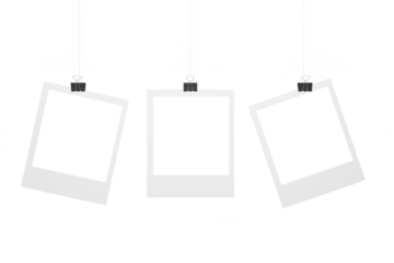 Photo frames hang on a rope, fixed with stationery clothespins. Three empty photo frames for your design.