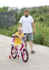 Girl to learn to ride a bike.