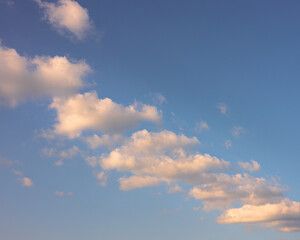 Fototapeta na wymiar Puffy white clouds on blue sky