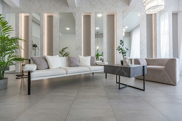 stylish bright modern bedroom interior with decorative niches with LED lighting and a huge panoramic window in gray and white colors and geometric shapes