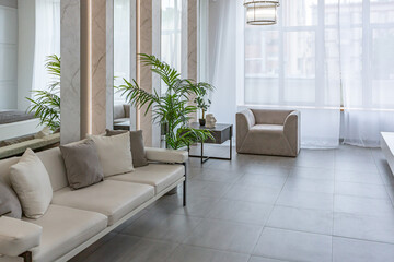 stylish bright modern bedroom interior with decorative niches with LED lighting and a huge panoramic window in gray and white colors and geometric shapes